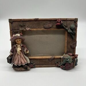 A Richesco Corporation Girl With Roses Suitcase Hand Painted Resin picture frame